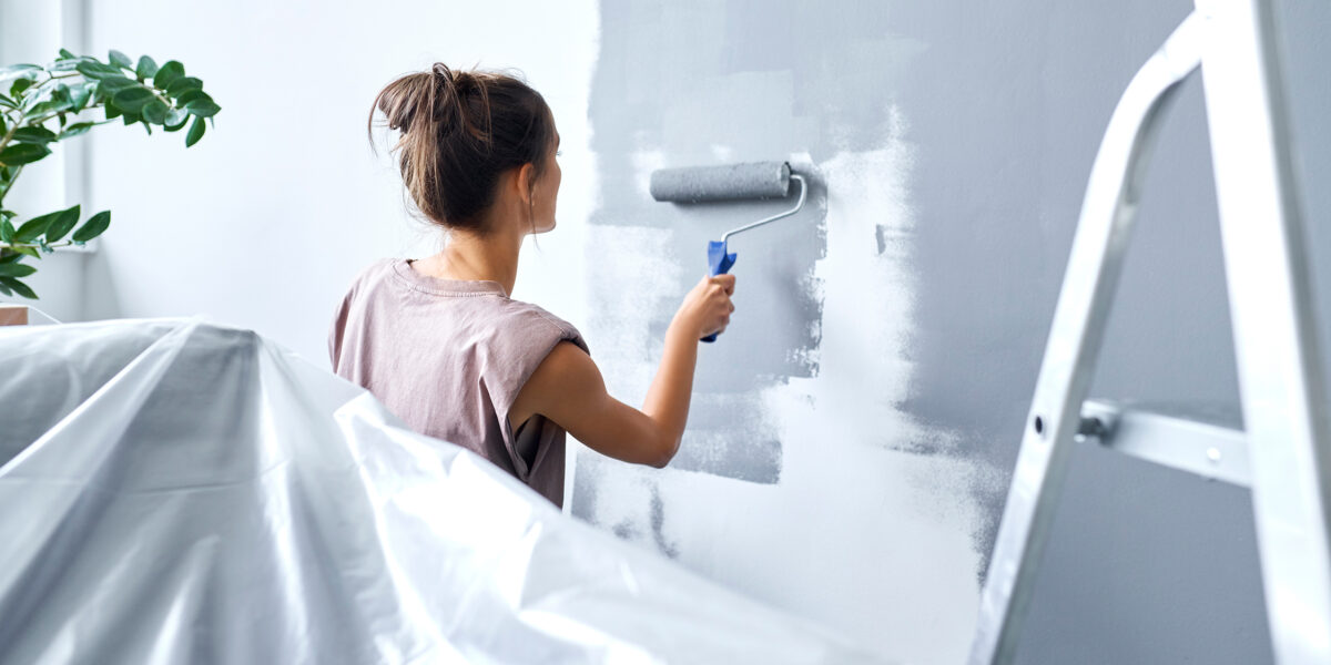 Woman Painting Wall